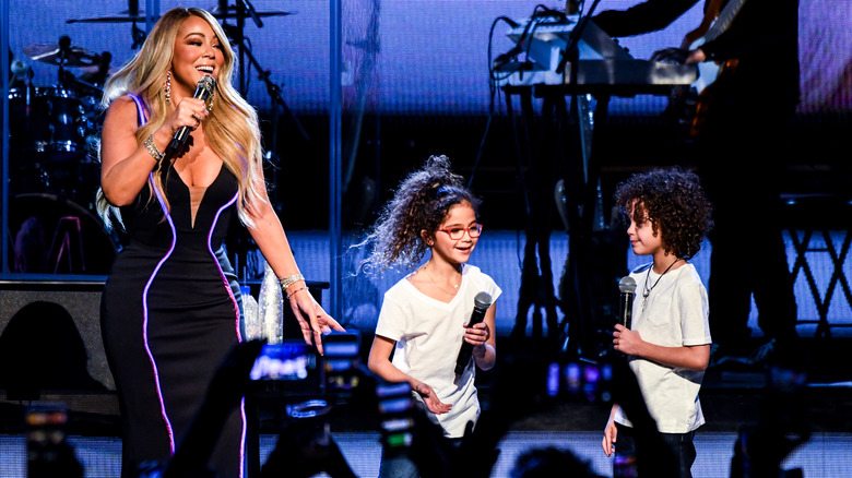 Mariah Carey onstage with twins