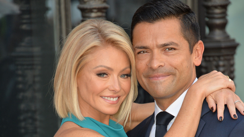 Kelly Ripa and Mark Consuelos hugging