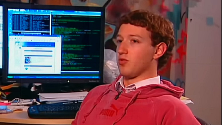 Mark Zuckerberg sits in front of desktop