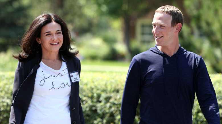 Mark Zuckerberg and Sheryl Sandberg smiling