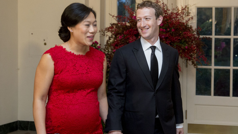 Mark Zuckerberg and Priscilla Chan laughing