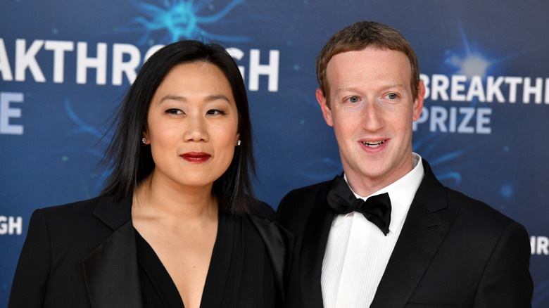 Priscilla Chan and Mark Zuckerberg posing