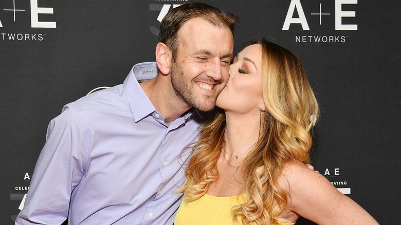 Married at First Sight Season 1's Jamie kissing her husband Doug on the cheek in 2019