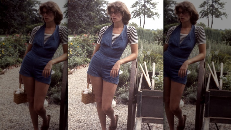 Martha Stewart holding basket of eggs