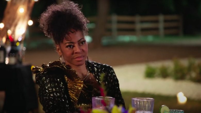 Mary Cosby frowns at dinner