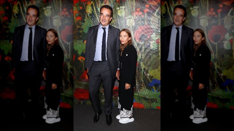 Mary-Kate Olsen and Olivier Sarkozy posing