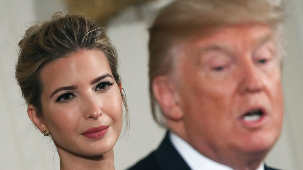 Ivanka Trump looks adoringly at her father during an event