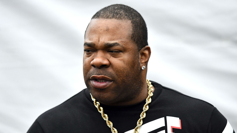 Busta Rhymes, speaking and looking to the side