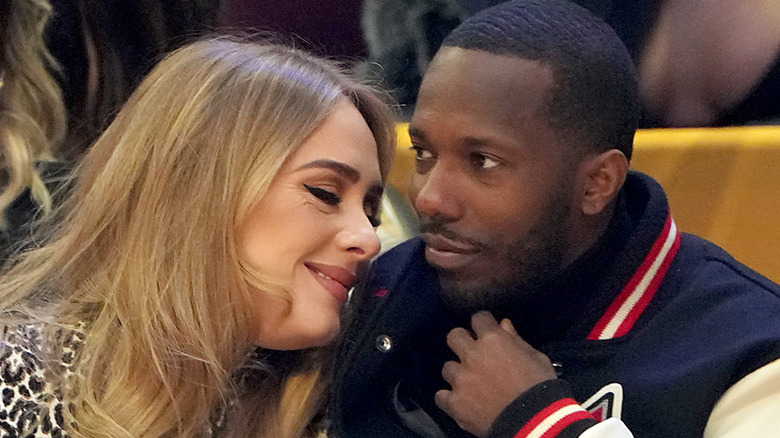 Adele smiling snuggling Rich Paul