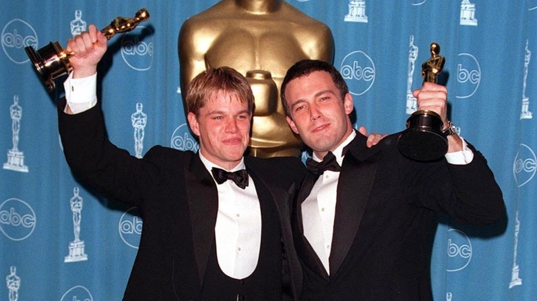 Matt Damon and Ben Affleck holding Oscars