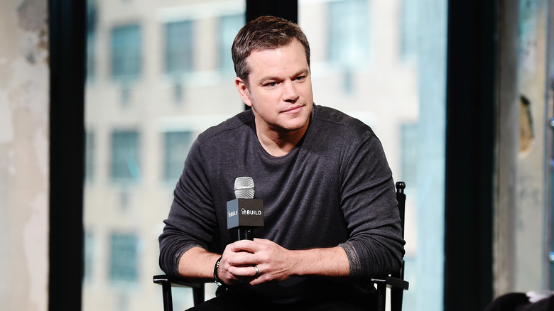 Matt Damon sitting