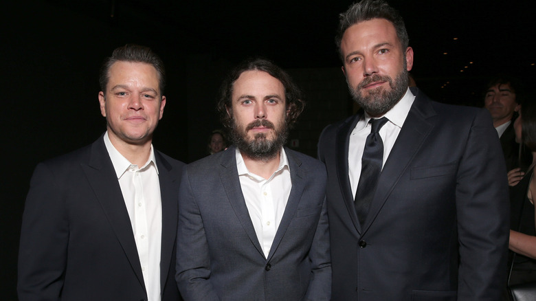 Matt Damon, Casey and Ben Affleck, all standing