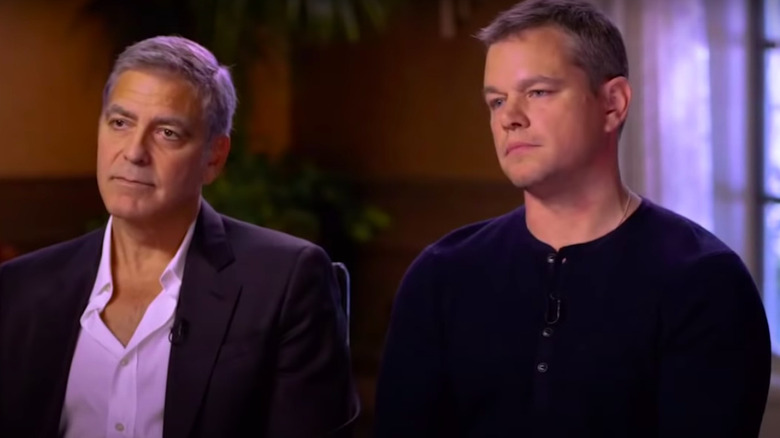 George Clooney and Matt Damon seated