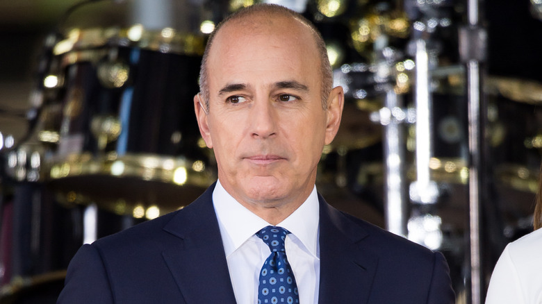 Matt Lauer standing on stage