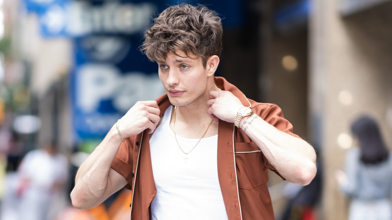 Matt Rife walking on city sidewalk