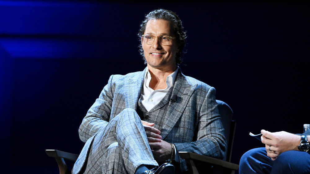 Matthew McConaughey sits and smiles