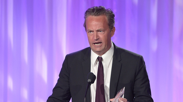 Matthew Perry speaking at an event