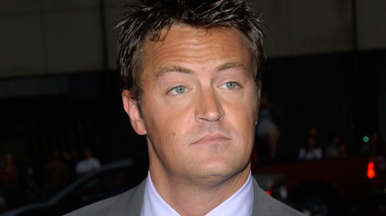 Matthew Perry with a neutral expression