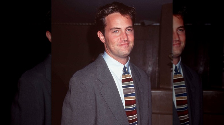 Matthew Perry posing in the '90s