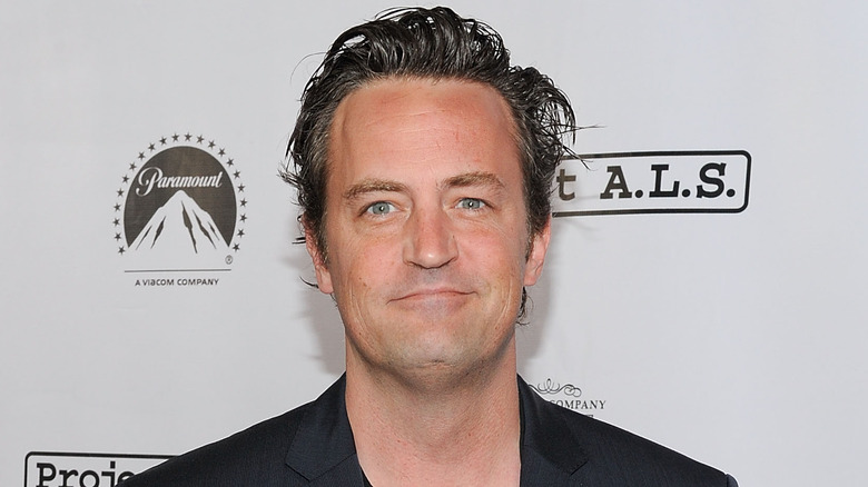 Matthew Perry smirking