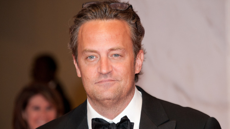 Matthew Perry smirking