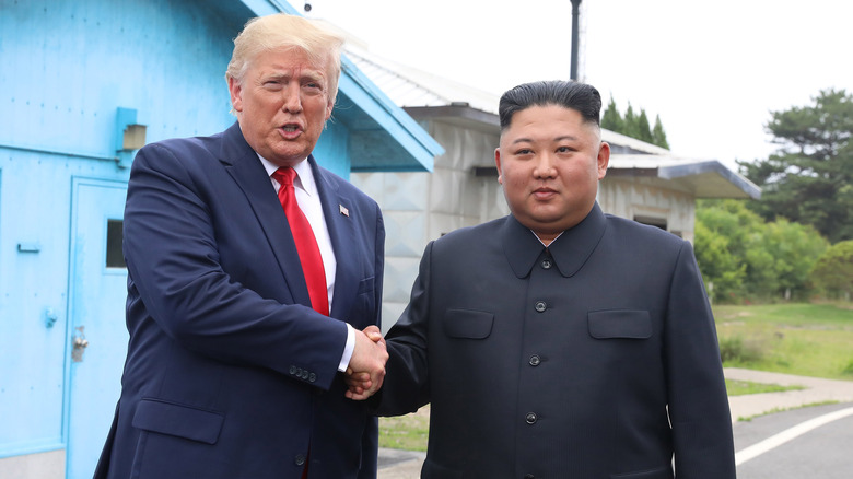 Donald Trump posing with Kim Jong-un