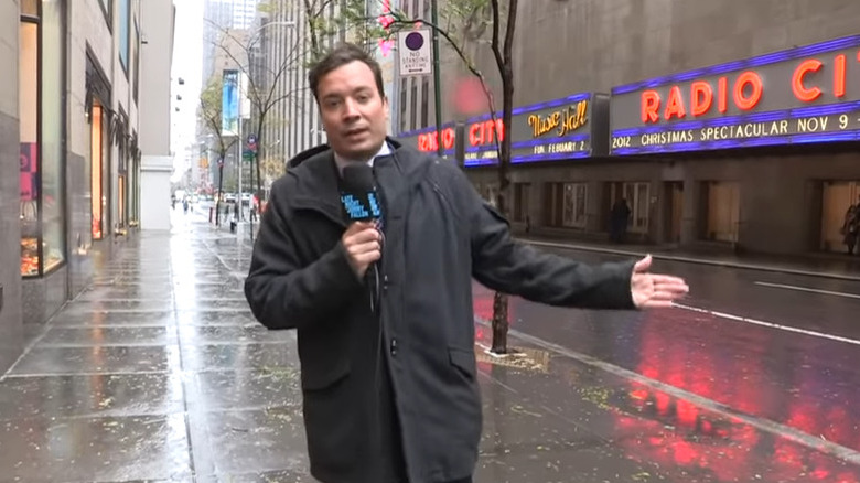 Jimmy Fallon outside with microphone