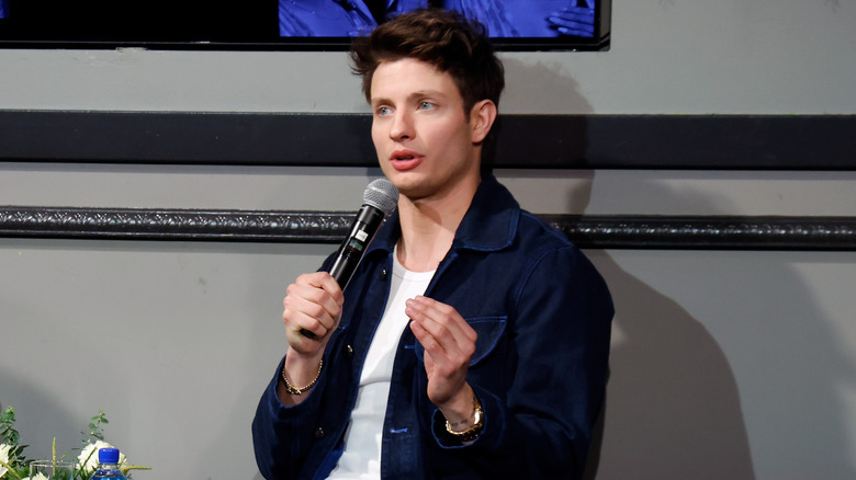 Matt Rife sitting with microphone