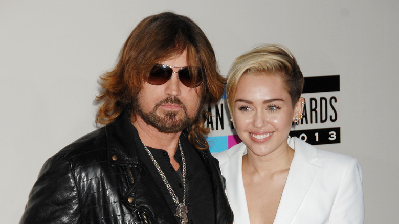 Miley and Billy Ray Cyrus posing together