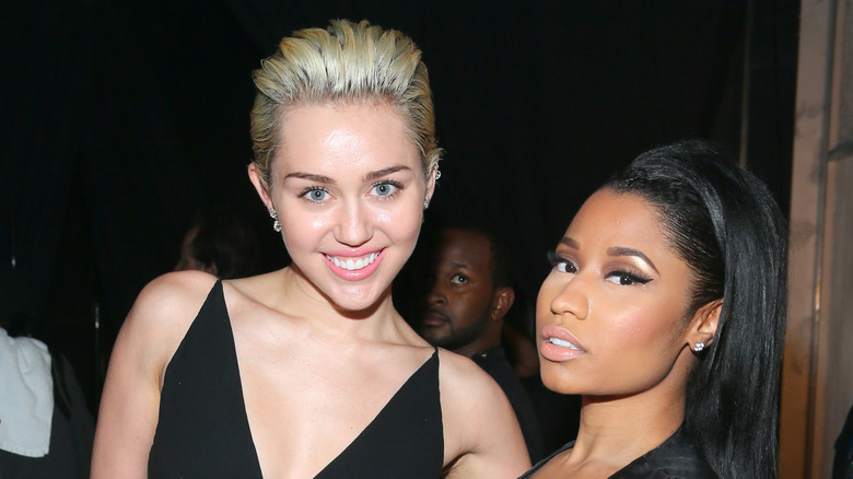 Miley Cyrus poses with Nicki Minaj