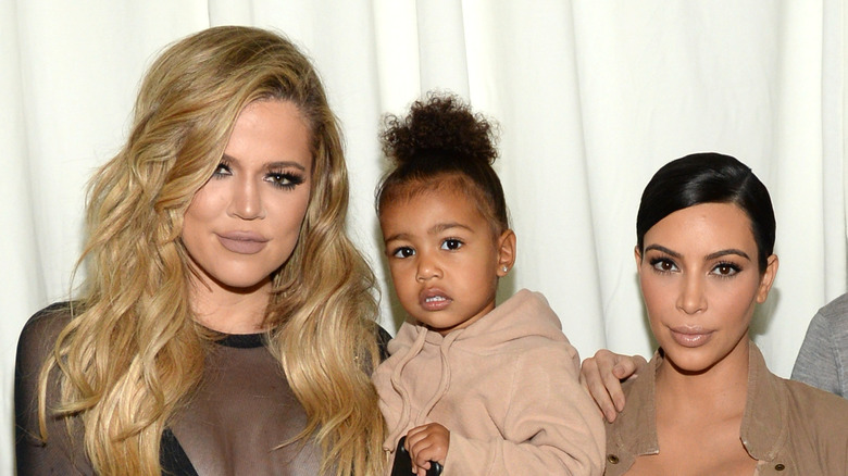 North West poses with Kim and Khloe Kardashian
