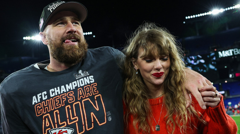 Travis Kelce and Taylor Swift holding hands