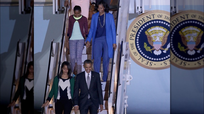 The Obamas arriving in South Africa in 2013