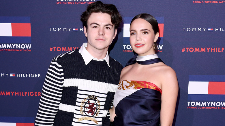 Blake Richardson posing on the red carpet with Bailee Madison at Tommy Hilfiger event