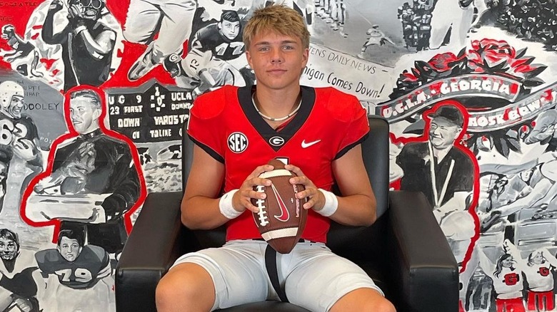 Isaac Wilson posing in a uniform