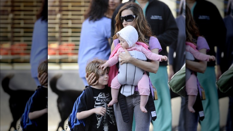 Marion Loretta Broderick touching her brother's head