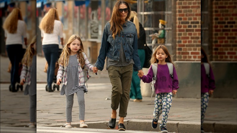 Sarah Jessica Parker walking with twin daughters