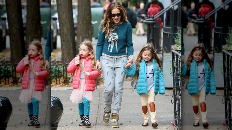 Sarah Jessica Parker walking outdoors with daughters