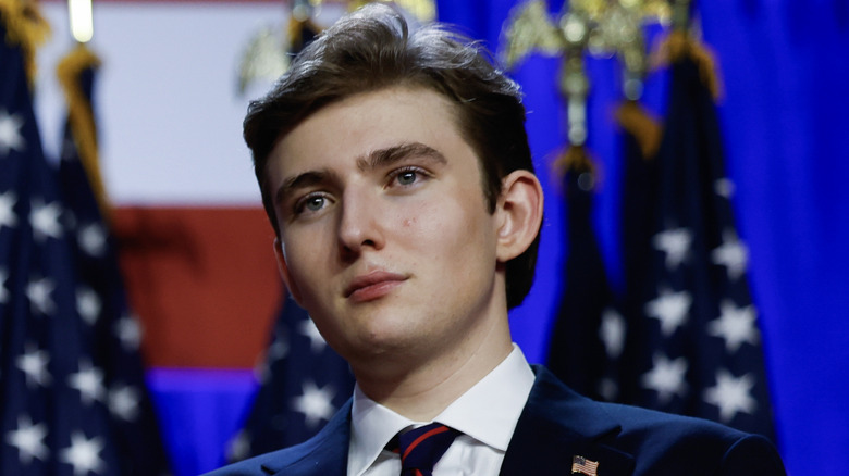 Barron Trump smiling at an election night event at the Palm Beach Convention Center