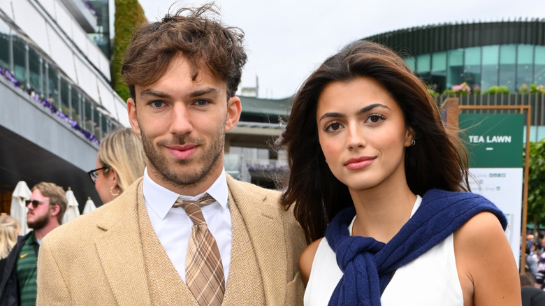 Franscisca Gomes posing for photographers with Pierre Gasly at the Wimbeldon championships in July 2024