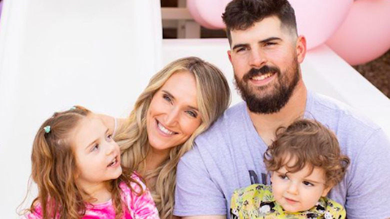 Carlos Rodon snuggling up with wife Ashley and their children