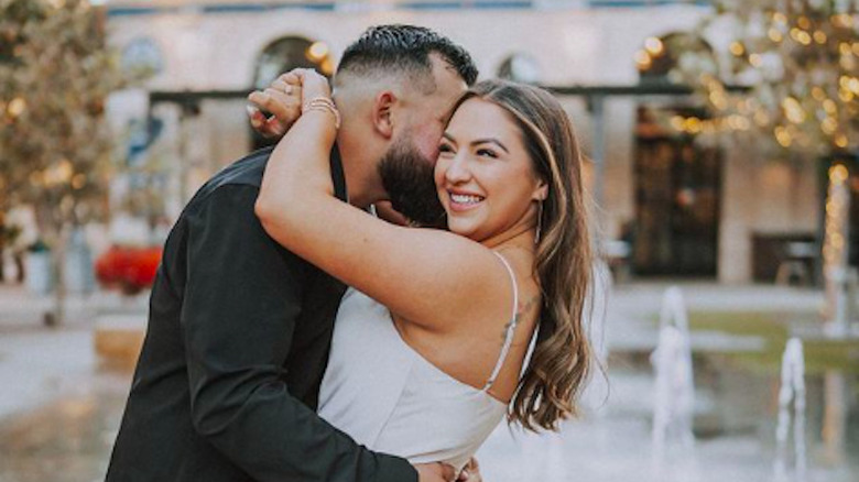 Jose Trevino kissing wife Markie Mandel at their wedding