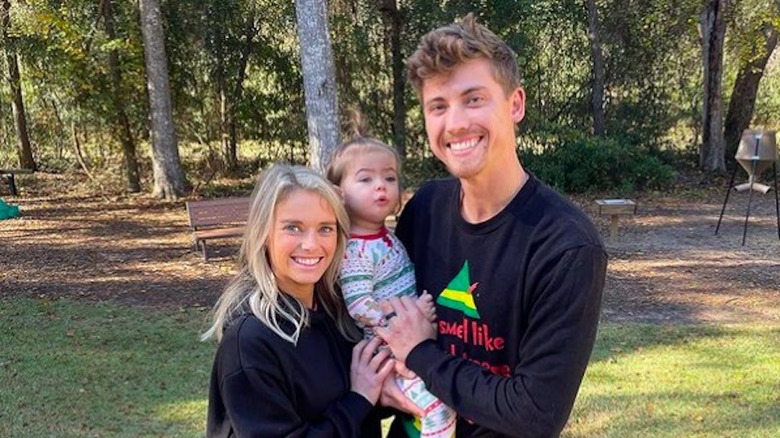 New York Yankees relief pitcher Luke Weaver posing with his wife and child