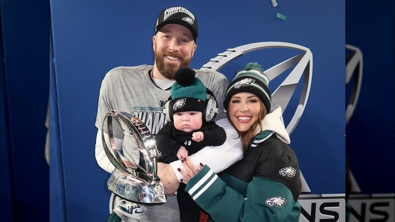 Rick and Jordan Lovato smiling and holding their son Freddie