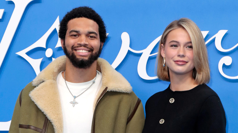 Caleb Williams and Alina Thyregod on red carpet