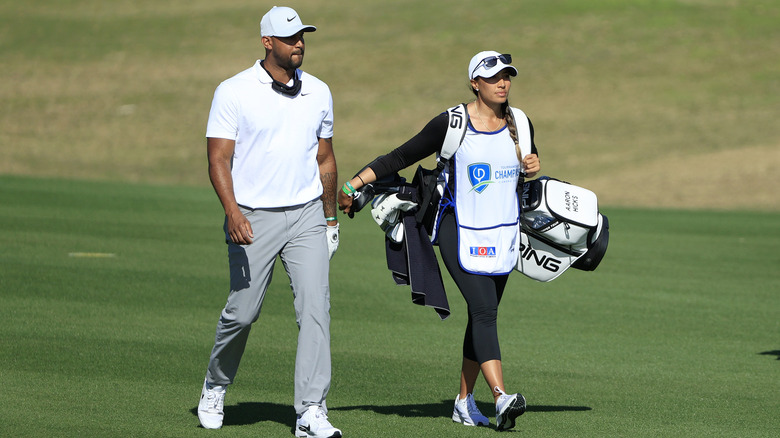 Aaron Hicks and Cheyenne Woods Hicks golfing