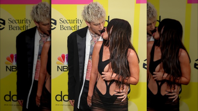 Machine Gun Kelly and Megan Fox touching tongues