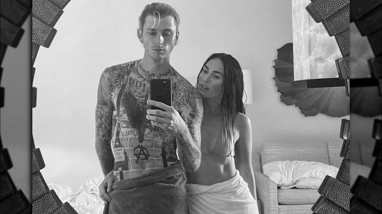 Machine Gun Kelly and Megan Fox wearing towels