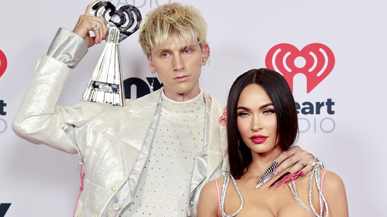 Megan Fox and Machine Gun Kelly pose side by side