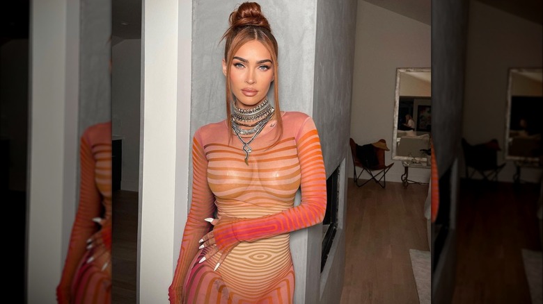 Megan Fox wearing sheer orange dress